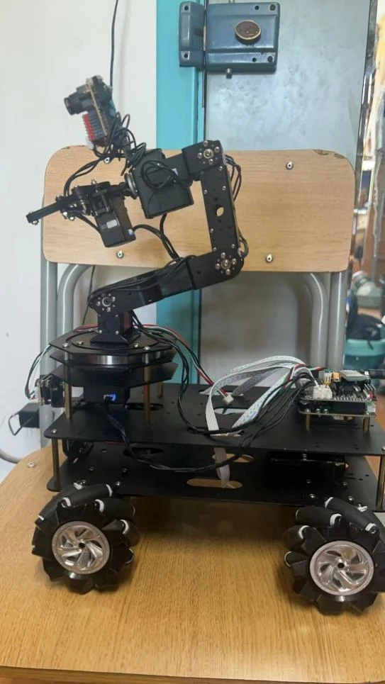 The wheeled robotic arm during a manipulation test.